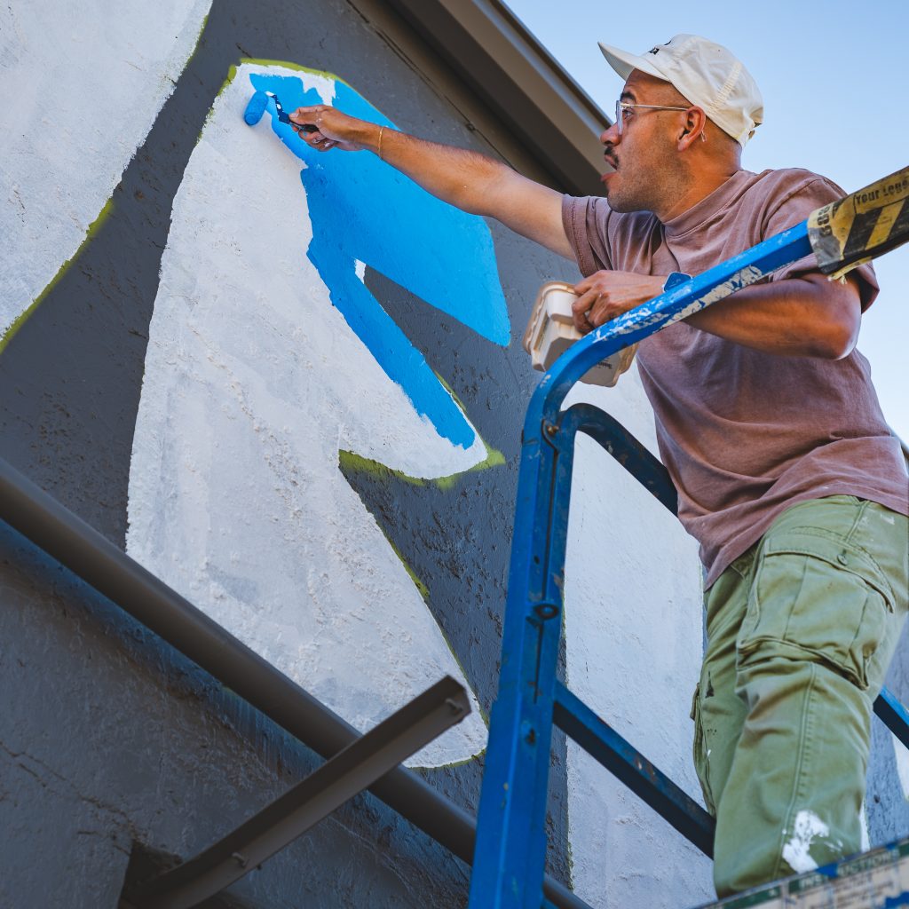 Photo from “You Are Here: WeldWalls Mural Festival Celebrates Local Culture Through Art”