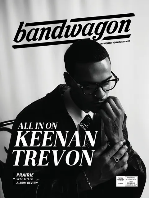 Keenan TreVon, the cover story subject, sits in black and white with glasses and hands clasped at his chin.